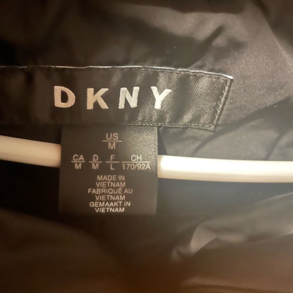 DKNY women’s black coat size medium with silver zippers and black hood